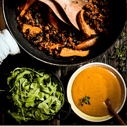 This vegan sweet potato skillet is the perfect fall food with crispy aromatic sweet potatoes, fresh rocket salad and hearty veggie mince with nourishing black beans.