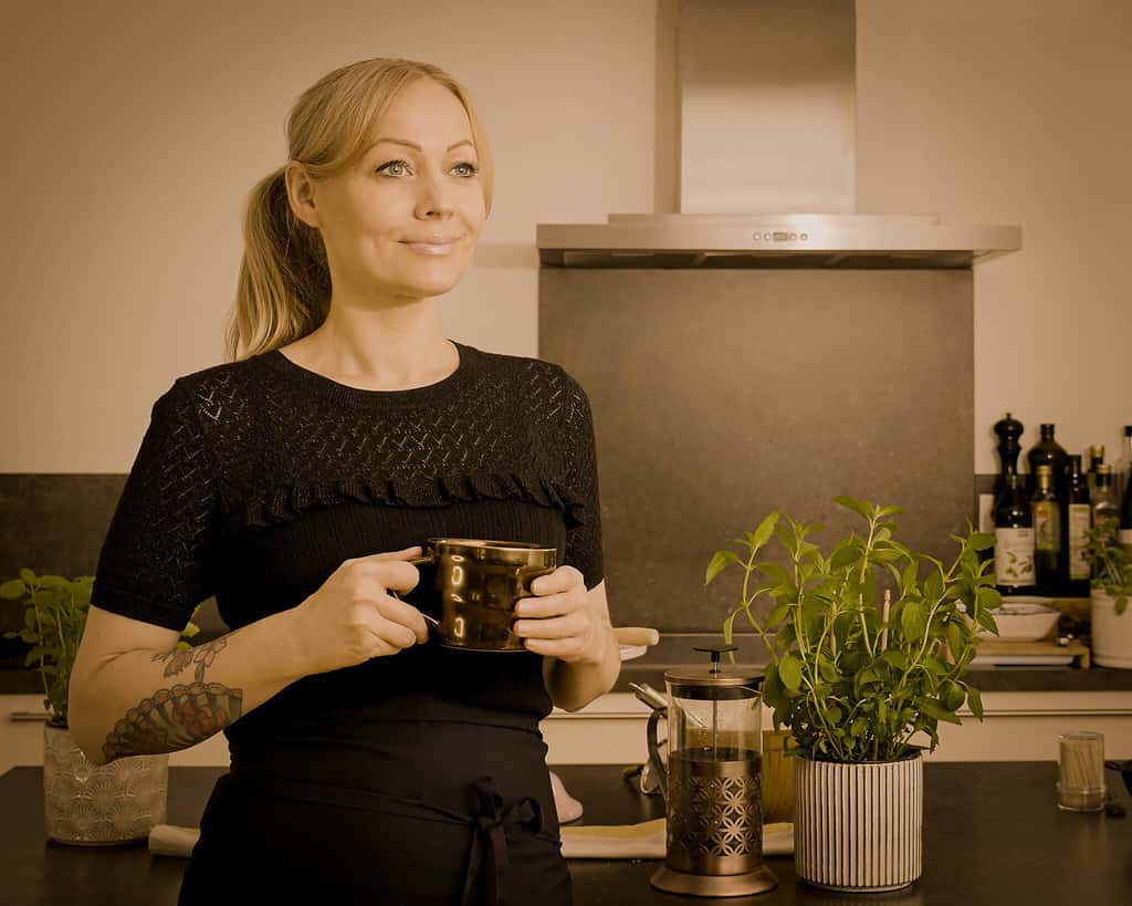 NIna in kitchen with coffee