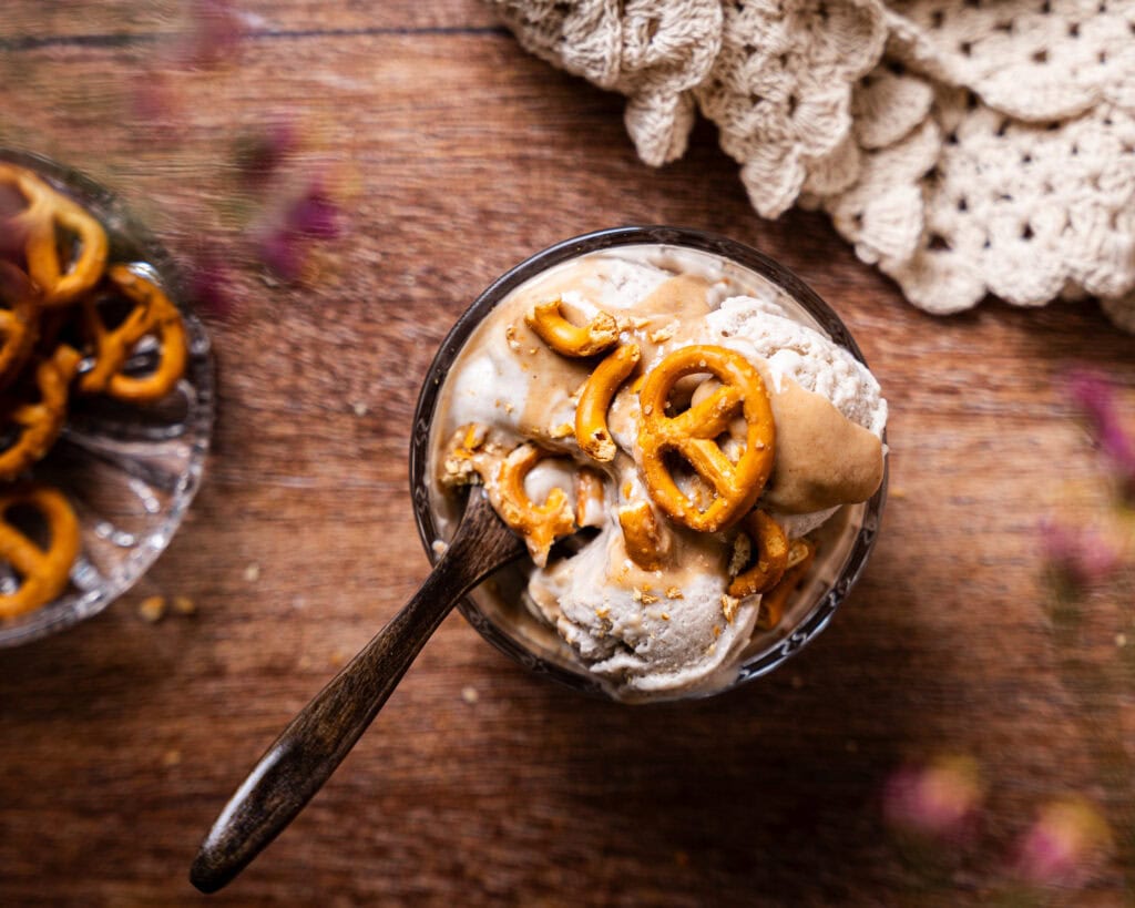 Vegan Banana Ice Cream with Date Caramel and mini pretzels in bowl from above