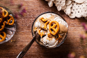 Vegan Banana Ice Cream with Date Caramel and mini pretzels in bowl from above