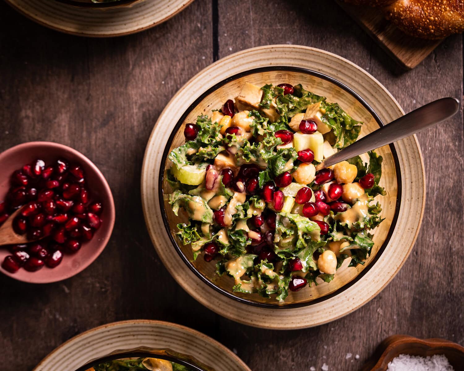 kale salad with roasted sesame dressing and pomegranate